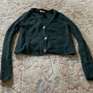 Green sweater top.